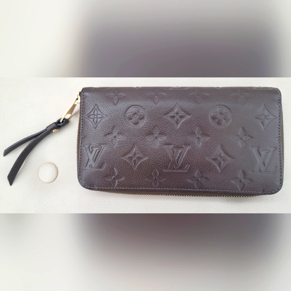 Louis Vuitton Monogram Empreinte Zippy Wallet in brown - Picture 1 of 12